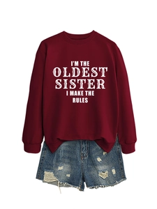 Detail of the white text print on a dark red sister themed sweatshirt garment