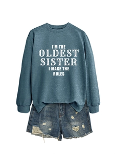 Detailed view of the ribbed cuffs and hem on the blue I'm the oldest sister sweatshirt