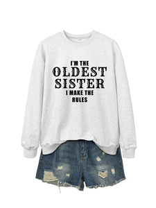 Detail of grey sweatshirt and denim shorts set with I'm the oldest sister slogan