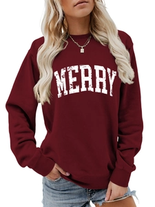 Close-up of ribbed cuffs and white distressed MERRY lettering on burgundy sweatshirt