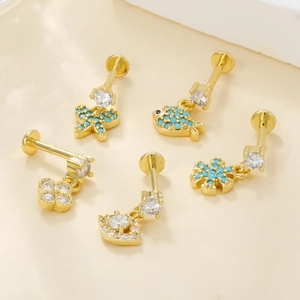 Detailed set of gold plated lip studs with zircon butterfly and turquoise charms