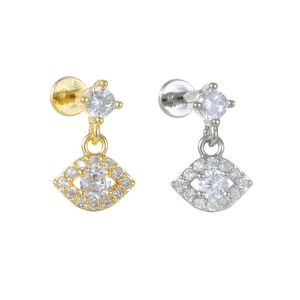 Detail of gold and silver devil eye stud earrings with micro-inlaid zircon and flat back