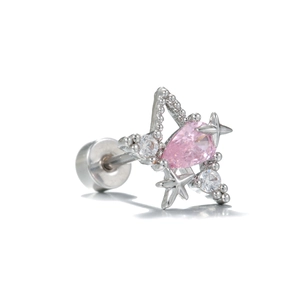 Macro shot of gold-plated star ear stud with a pink teardrop zircon and pavé detailing