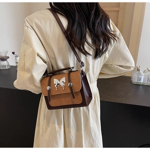 Retro contrast color shoulder bag with silver butterfly charm and matte leather texture