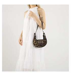 Detail view of leopard print hobo bag with adjustable strap and silver metal buckle