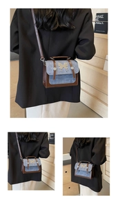 Detail of vintage contrast crossbody bag with butterfly hardware and denim stitching