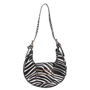 Chic zebra print crescent shoulder bag with golden metal buckle decoration on white background