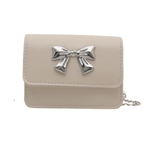 Chic off-white mini chain crossbody bag with a large silver metallic bow decoration