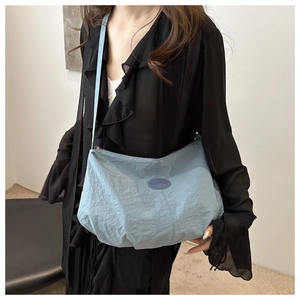 Light blue nylon cloud tote bag with adjustable strap and Fashion patch for daily use
