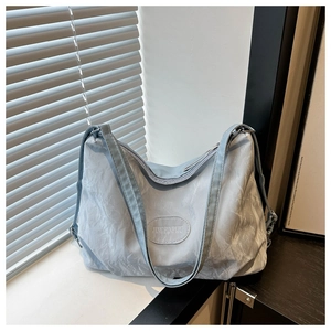 Versatile light blue large capacity tote bag with pleated texture and wide strap