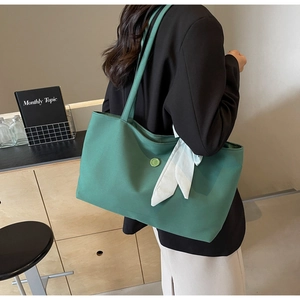Chic green canvas tote bag for women with a vintage button and stylish checkered ribbon