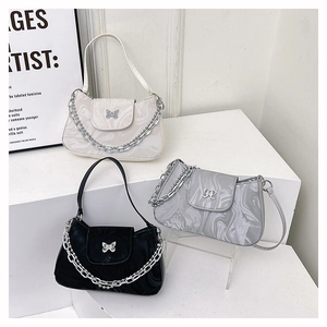 Three minimalist marble-pattern chain underarm bags in white, grey, and black colors