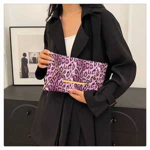 Detail of purple leopard print plush envelope clutch with gold metal buckle