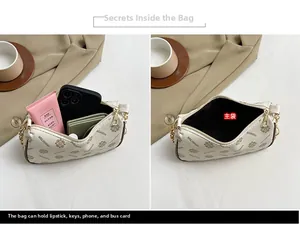Detailed interior view of the printed crossbody bag showing capacity for phone and essentials