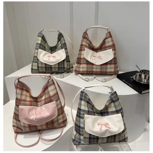Chic checkered canvas tote bags with bow embroidery in four colors on a white display