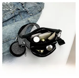 Interior capacity of black rhinestone crossbody bag with phone and cosmetics