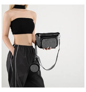 Detail of sparkling rhinestone moon bag with detachable round coin purse and woven strap