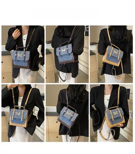 Detail of denim patchwork square bag with butterfly buckle showing multi-way wear styles