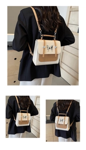 Three views of a two-tone square backpack with butterfly buckle and adjustable straps