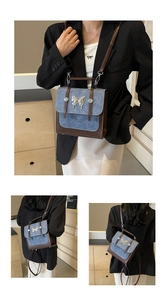 Detail of retro contrast crossbody bag with denim texture and silver butterfly ornament