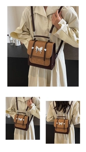 Detail of retro contrasting color crossbody bag featuring silver butterfly metal buckle