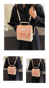 Contrast color vintage backpack with pink matte flap and silver butterfly buckle detail
