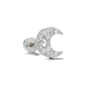 Macro detail of crescent moon stud earring with sparkling cubic zirconia on silver metal