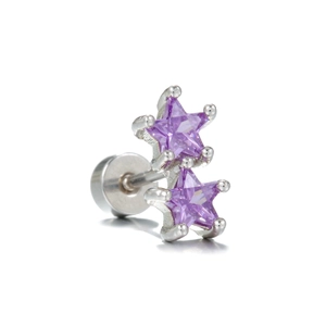 Macro detail of silver earrings featuring two purple star zircons and flat screw back