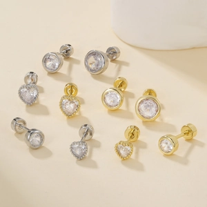 Assorted gold and silver heart and round stud earrings with screw backs and zircons