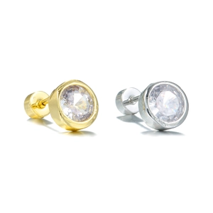 Macro view of gold and silver round cubic zirconia stud earrings with screw-back design