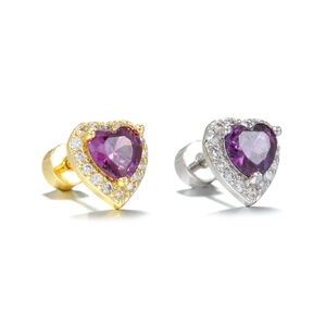 Close-up of heart-shaped purple zircon earrings in gold and silver pave settings