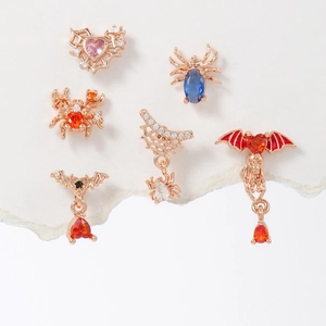 Halloween jewelry set with bat heart and spider charms in rose gold plating