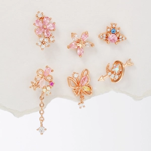 Detailed set of rose gold plated stud earrings with zircons in butterfly and bee designs