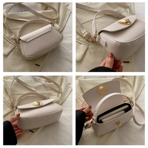 Detail view of beige crossbody bag with shell lock, showing back, side and interior