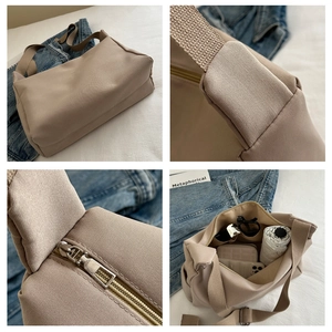 Detail view of large beige canvas bucket bag with secure zipper and spacious interior