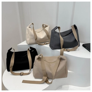 Large nylon tote bags in four colors with wide adjustable shoulder straps and side pockets