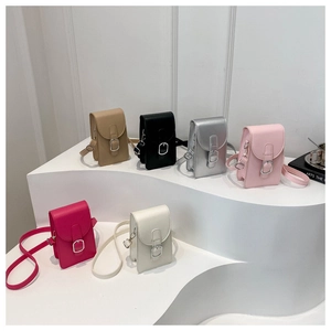 Chic leather crossbody phone bags in six colors displayed on minimalist white stairs