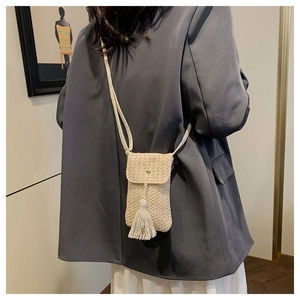 Handwoven straw cell phone crossbody bag with chic fringe tassel and gold buckle