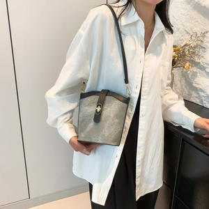 Retro grey water-washed texture bucket bag with black leather trim and gold metal buckle