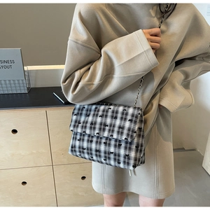 Retro black and white plaid tote bag with bow embroidery and chain strap on shoulder