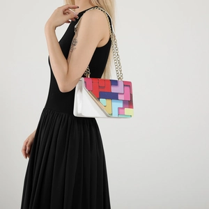Chic women's white shoulder bag featuring vibrant colorful geometric patterns and gold chain