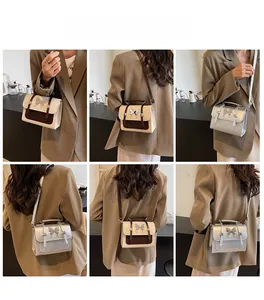 Détails du sac bandoulière femme avec boucle papillon et différentes options de port