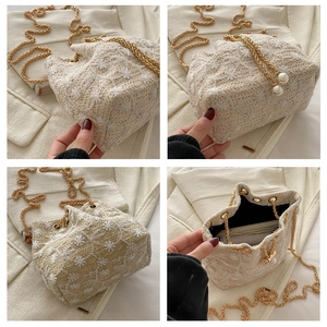 Detailed views of beige knit bucket bag with floral embroidery and gold chain strap