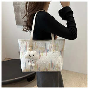 White embroidered canvas tote bag with colorful curves and cloud charm for women