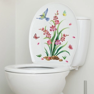 Detailed view of floral toilet sticker with hummingbird and butterflies on white cover