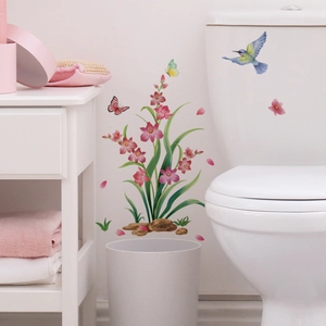 Detailed wall sticker featuring pink orchids, hummingbirds, and butterflies in a bathroom décor
