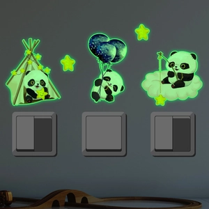 Luminous panda wall stickers glowing in the dark around a power switch decor