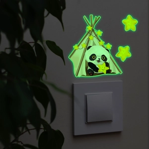 Glow-in-the-dark panda and stars wall sticker glowing near light switch in dark bedroom