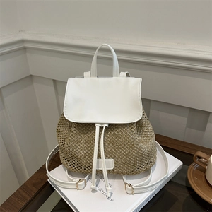 Minimalist straw backpack with white leather trim and woven mesh for summer travel