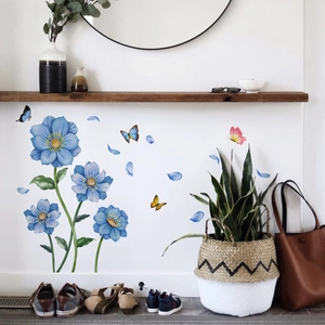 Blue floral and butterfly wall stickers applied on an entryway wall for home decoration